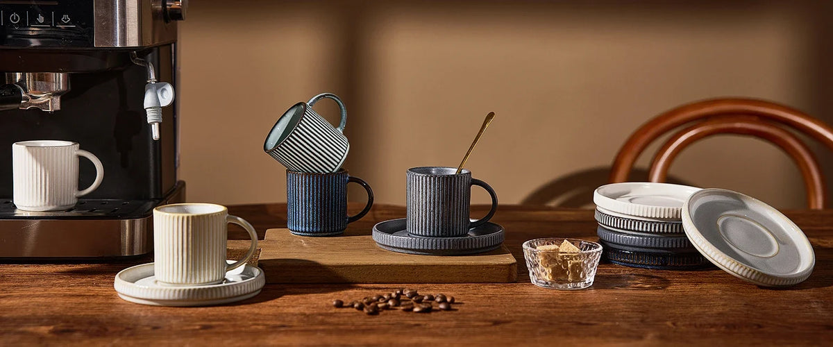 Set of ceramic espresso cups, saucers, and small serving pieces