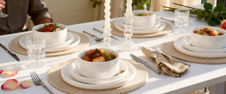 White ceramic dinnerware arranged on a dining table