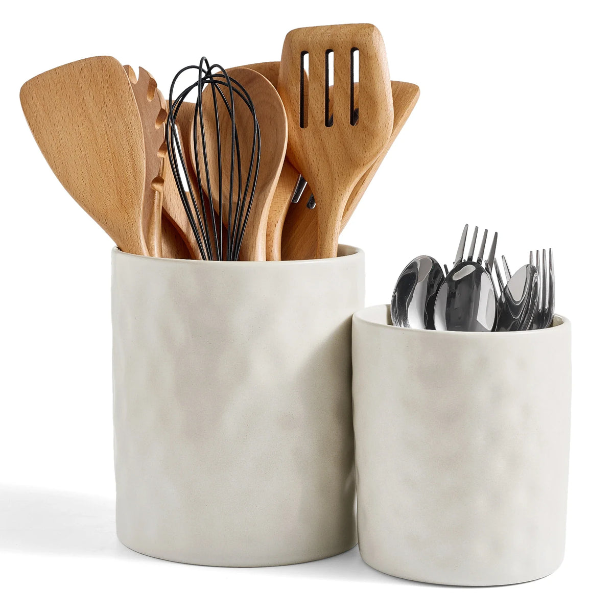 Two plain white ceramic utensil holders containing wooden tools and silverware