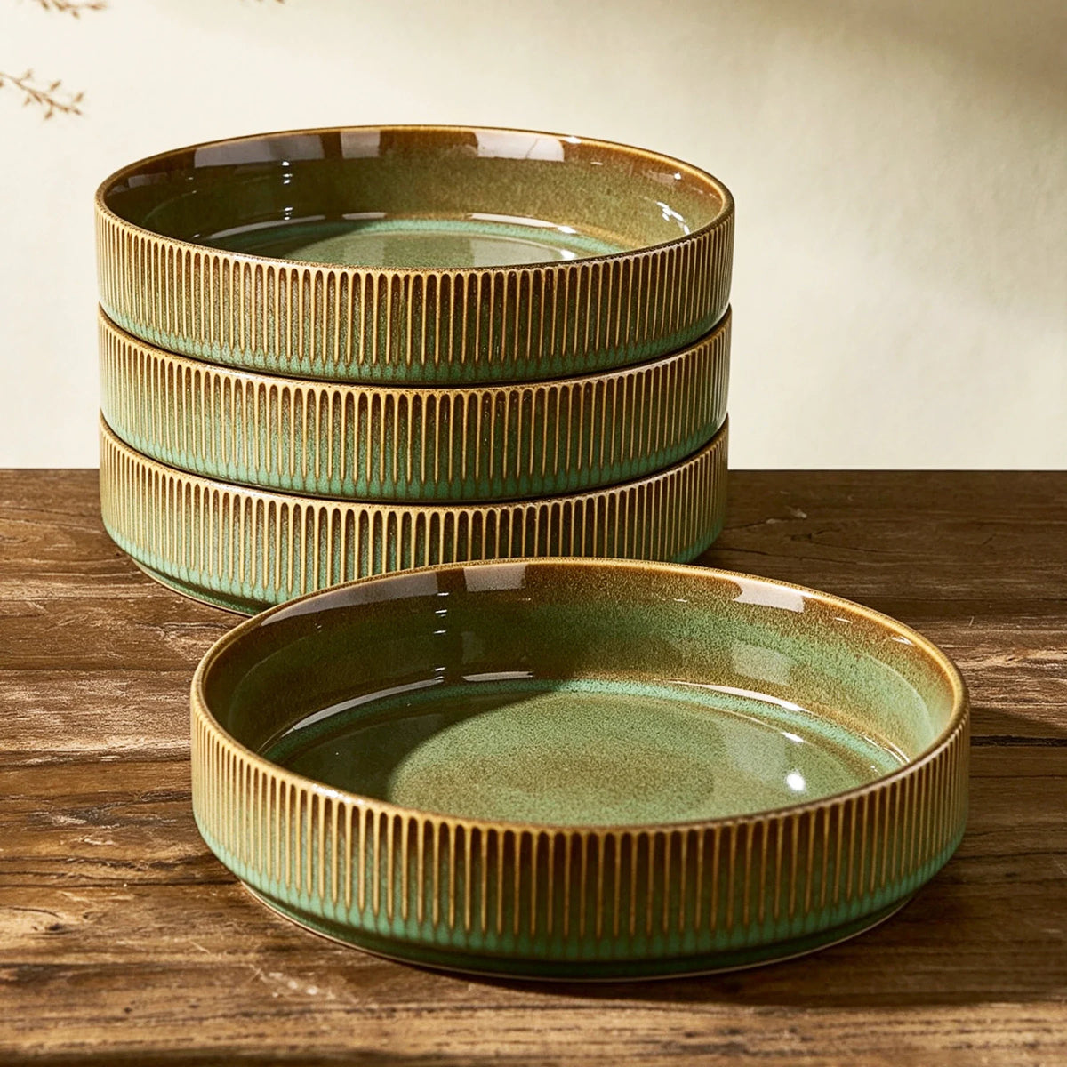 Green ribbed ceramic bowls with wide open interiors