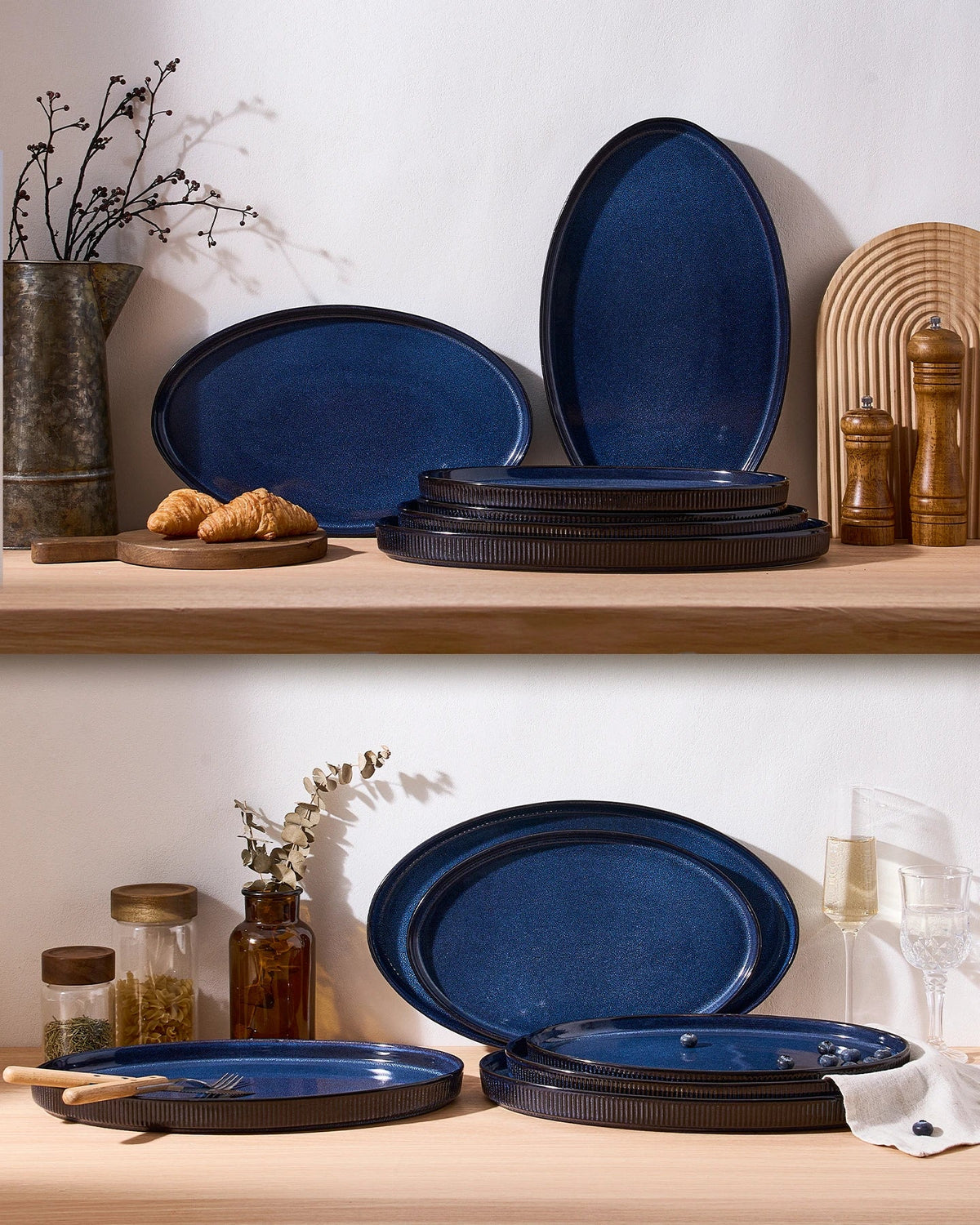 Blue ceramic serving platters arranged and stacked on a counter