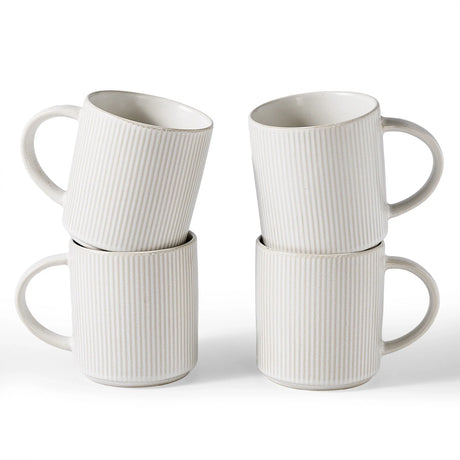 Four white ribbed ceramic mugs ready for a home beverage station