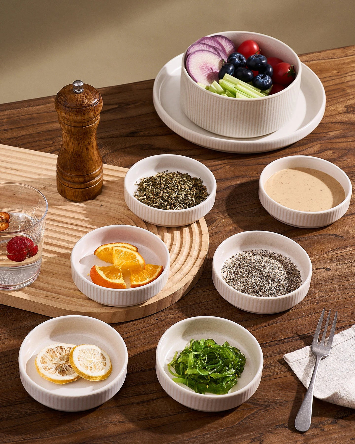 Ceramic sauce dishes holding several condiments