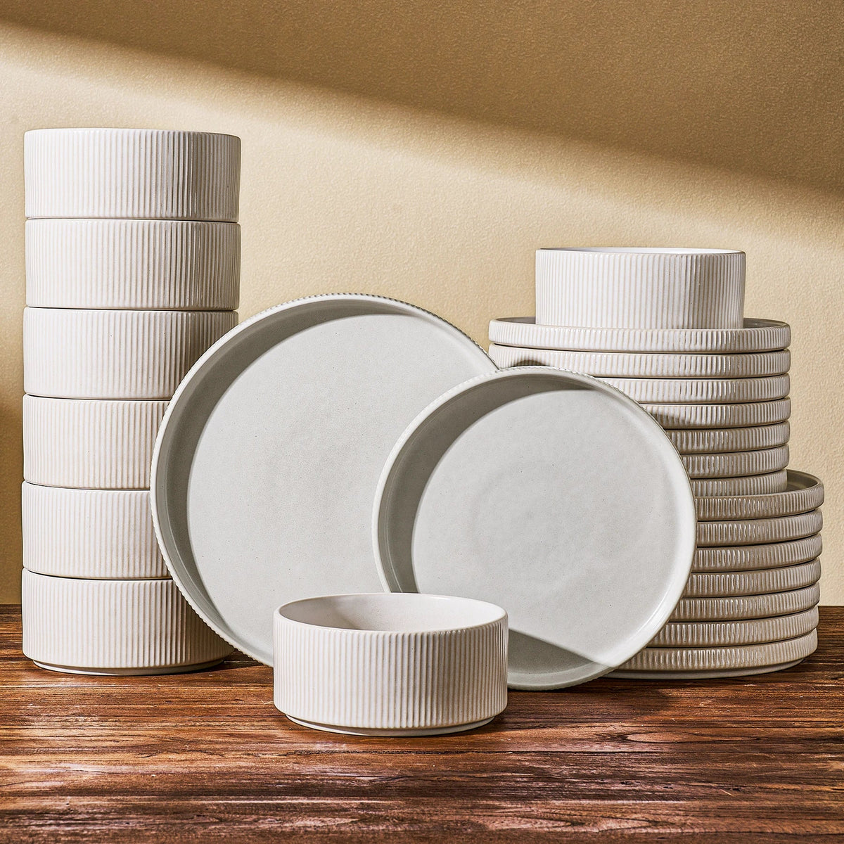 Twenty-four-piece white Famiware dinnerware set arranged in stacks