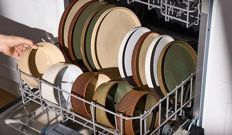 Ribbed Famiware stoneware arranged in a dishwasher rack