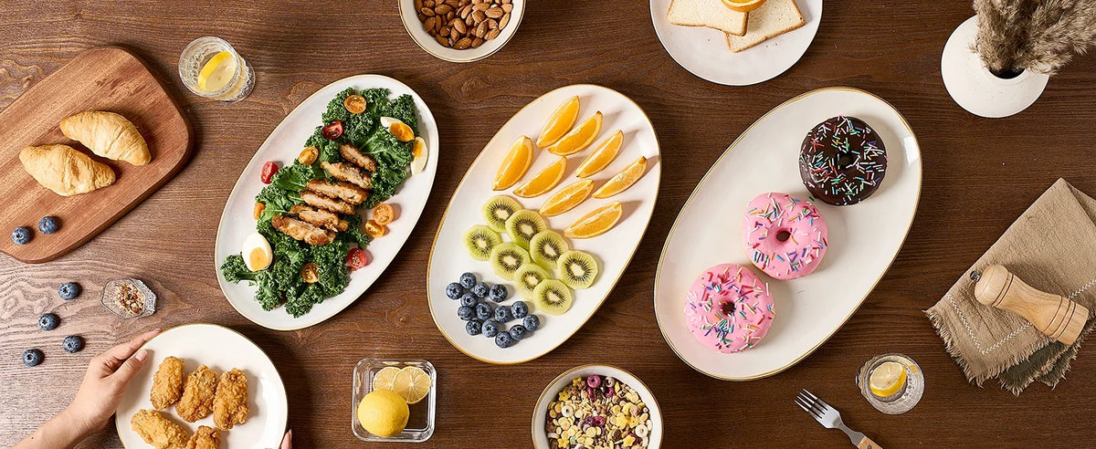 Three oval Famiware platters arranged with shared dishes